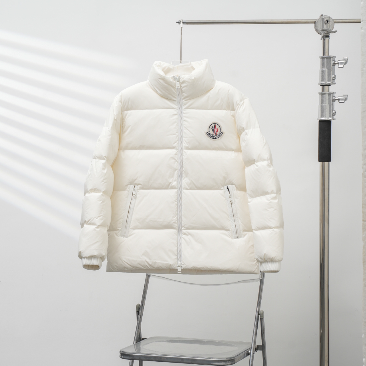Moncler stand-collar down jacket with a large chest logo