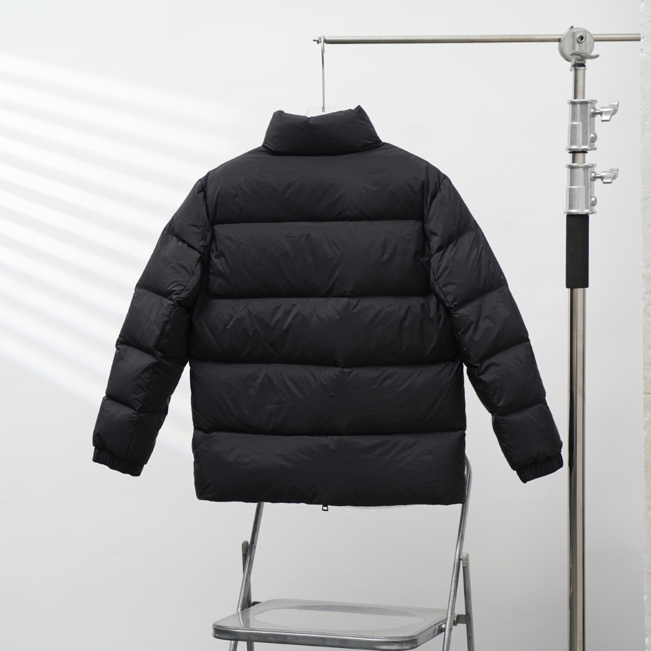 Moncler stand-collar down jacket with a large chest logo